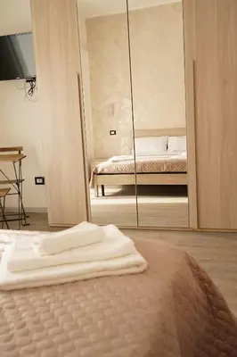 Letto o letti in una camera di LA RESIDENZA DI ADAMO