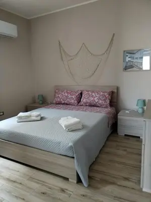 Letto o letti in una camera di Casa Framaibla - la veranda sull'Etna