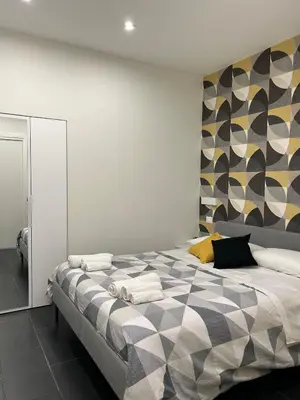 Letto o letti in una camera di A.R Apartments