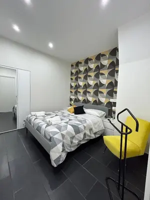 Letto o letti in una camera di A.R Apartments