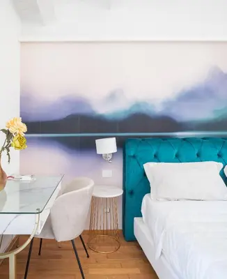 Letto o letti in una camera di MILLE SUITE GARDEN