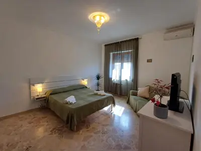 Letto o letti in una camera di Domus Theresa IV Vista Ortigia