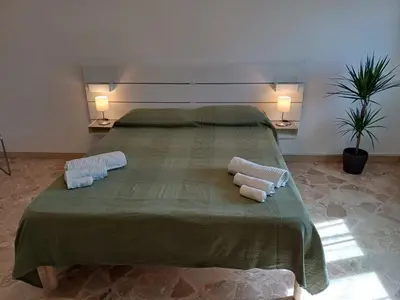 Letto o letti in una camera di Domus Theresa IV Vista Ortigia