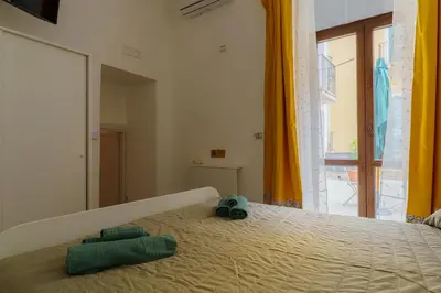Letto o letti in una camera di Casta Diva Holiday Rooms