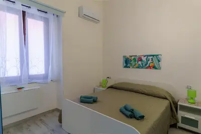 Letto o letti in una camera di Casta Diva Holiday Rooms