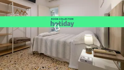 Letto o letti in una camera di HOTIDAY Ortigia Opera