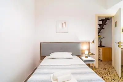 Letto o letti in una camera di HOTIDAY Ortigia Opera