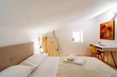 Letto o letti in una camera di HOTIDAY Ortigia Opera