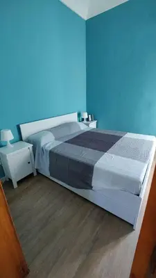 Letto o letti in una camera di Ortigia Porta del Mare