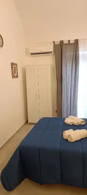 Letto o letti in una camera di Nel cuore di tutto