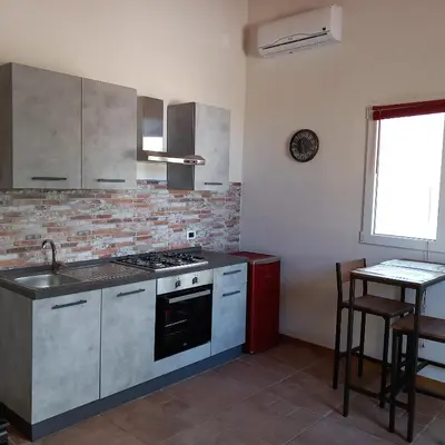 Cucina o angolo cottura di Dimore del Carrubo - openspace con piscina
