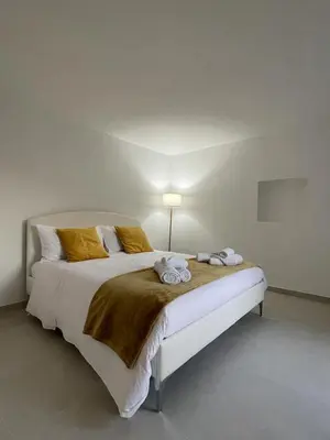Letto o letti in una camera di Cutelli Gold