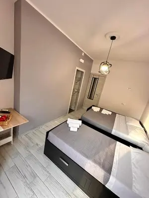 Letto o letti in una camera di Airport Al Volo B&B