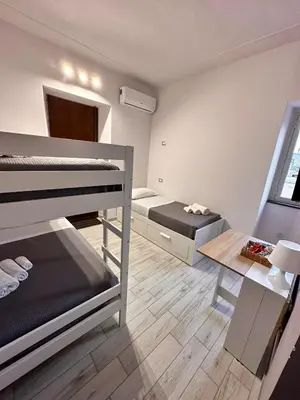 Letto o letti in una camera di Airport Al Volo B&B