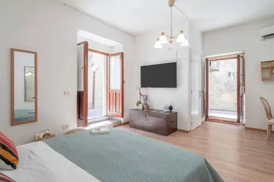 Letto o letti in una camera di Dione terrace apartments by Dimore in Sicily