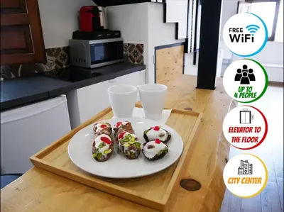 Cucina o angolo cottura di NINETTI GUEST HOUSE - Apt CENTRO STORICO-500m dal Duomo