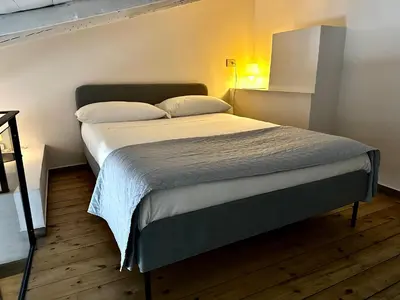 Letto o letti in una camera di NINETTI GUEST HOUSE - Apt CENTRO STORICO-500m dal Duomo