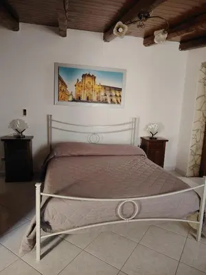 Letto o letti in una camera di LA ZAGARA